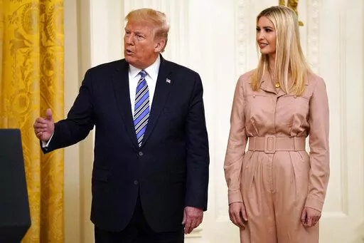 FILE - President Donald Trump speaks during an event about the Paycheck Protection Program used to support small businesses during the coronavirus outbreak, in the East Room of the White House, April 28, 2020, in Washington, as Ivanka Trump listens. New York Attorney General Letitia James recently subpoenaed former President Donald Trump and his two eldest children, demanding their testimony in connection with an ongoing civil investigation into the family's business practices, according to a co