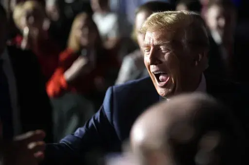 Republican presidential candidate former President Donald Trump greets people after a Fox News Channel town hall Tuesday, Feb. 20, 2024, in Greenville, S.C. (AP Photo/Chris Carlson)