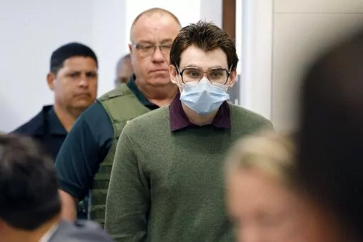 Marjory Stoneman Douglas High School shooter Nikolas Cruz enters the courtroom before jury pre-selection in the penalty phase of his trial at the Broward County Courthouse in Fort Lauderdale, Fla. on Monday, April 4, 2022. Cruz previously plead guilty to all 17 counts of premeditated murder and 17 counts of attempted murder in the 2018 shootings. (Amy Beth Bennett/South Florida Sun Sentinel via AP, Pool)