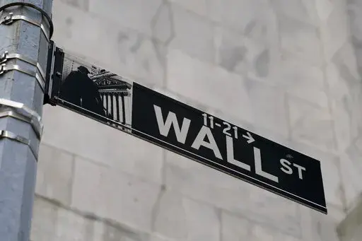 A Wall Street sign is shown in the Financial District, on Oct. 13, 2021, in the Manhattan borough of New York. Stocks are opening lower on Wall Street on Friday, June 3, 2022, putting indexes back into the red for the week. (AP Photo/John Minchillo, File)