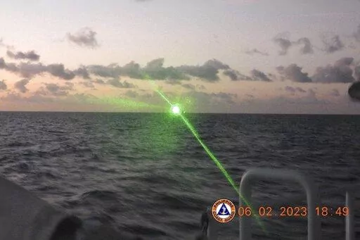 This photo provided by the Philippine Coast Guard shows a green military-grade laser light from a Chinese coast guard ship in the disputed South China Sea, Monday, Feb. 6, 2023. The Philippines on Monday, Feb. 13, accused a Chinese coast guard ship of hitting a Philippine coast guard vessel with a military-grade laser and temporarily blinding some of its crew in the disputed South China Sea, calling it a "blatant" violation of Manila's sovereign rights. (Philippine Coast Guard via AP)