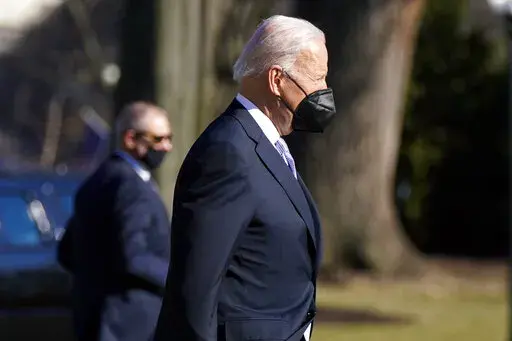 President Joe Biden walks to board Marine One on the South Lawn of the White House, Friday, Feb. 11, 2022, in Washington to travel to Camp David, Md. (AP Photo/Manuel Balce Ceneta)