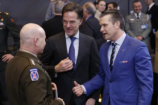 United States Secretary of Defense Pete Hegseth, right, speaks with NATO Secretary General Mark Rutte, center, and NATO's Supreme Allied Commander Europe General Christopher Cavoli during a meeting of the North Atlantic Council in defense ministers format at NATO headquarters in Brussels, Thursday, Feb. 13, 2025. (AP Photo/Geert Vanden Wijngaert)