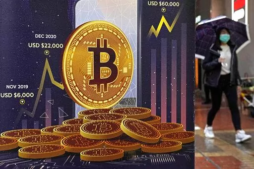 An advertisement for Bitcoin cryptocurrency is displayed on a street in Hong Kong on Feb. 17, 2022. Cryptocurrencies have experienced their worst plunge since 2018. As prices drop, companies collapse and skepticism soars, fortunes and jobs are disappearing overnight, and investors’ feverish speculation has been replaced by icy calculation, in what industry leaders are referring to as a “crypto winter.” (AP Photo/Kin Cheung, File)
