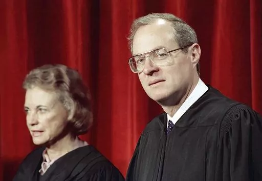 Justice Anthony Kennedy, the newest member of the Supreme Court, and Justice Sandra Day O'Connor, are shown on April 15, 1988, in Washington, at the Supreme Court during a picture taking session. The full court was also present for the photo session. For years, the Supreme Court moved to the left or right only as far as Justices O'Connor and Kennedy allowed. They held pivotal votes on a court closely divided between liberals and conservatives. Now, though, a more conservative court that includes