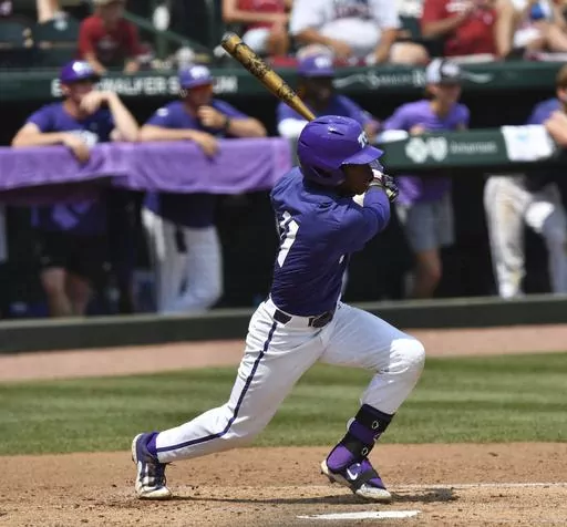TCU's Austin Davis connects with two-run single against Arkansas during the second inning of an NCAA college baseball tournament regional championship game in Fayetteville, Ark. Monday, June 5, 2023. (Andy Shupe/The Northwest Arkansas Democrat-Gazette via AP)