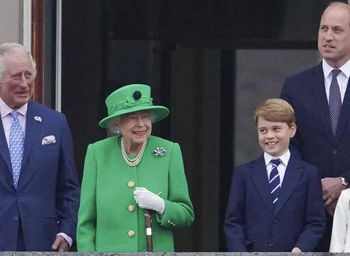 From left, Prince Charles, Queen Elizabeth II, Prince George and Prince William appear on the balcony of Buckingham Palace during the Platinum Jubilee Pageant outside Buckingham Palace in London, Sunday June 5, 2022.  After four days of parades, street parties and a gala concert celebrating Queen Elizabeth II's 70 years on the throne, the Platinum Jubilee ended Sunday with the crowd outside Buckingham Palace singing "God Save the Queen." But as the tributes to the queen's lifetime of service be