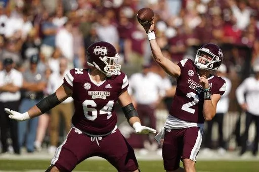Mississippi State quarterback Will Rogers (2) throws behind the block of offensive lineman Steven Losoya III (64) during the first half of an NCAA college football game  against Arkansas in Starkville, Miss., Saturday, Oct. 8, 2022. (AP Photo/Rogelio V. Solis)