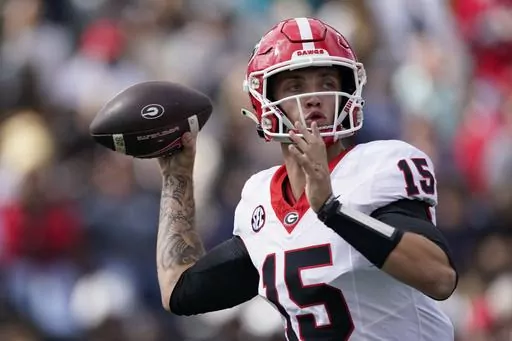 Georgia quarterback Carson Beck (15) looks to throw a pass against Vanderbilt in the second half of an NCAA college football game Saturday, Oct. 14, 2023, in Nashville, Tenn. (AP Photo/George Walker IV)