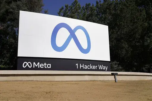Facebook's Meta logo sign is seen at the company headquarters in Menlo Park, Calif., on Oct. 28, 2021. Facebook’s corporate parent has agreed to pay $725 million to settle a lawsuit alleging the world’s largest social media platform allowed millions of its users’ personal information to be fed to Cambridge Analytica, a firm that supported Donald Trump’s victorious presidential campaign in 2016. (AP Photo/Tony Avelar, File)