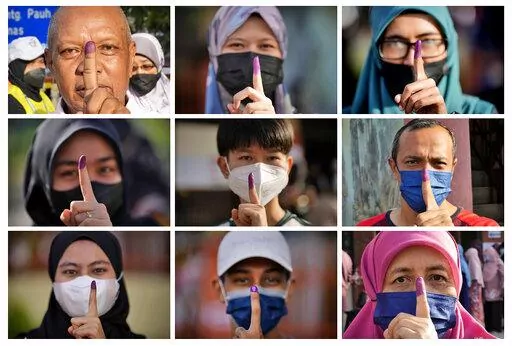 This combination of photos shows people with inked fingers to mark that they have voted during the national election in Seberang Perai, Penang state, Malaysia, Saturday, Nov. 19, 2022. Malaysians began casting ballots Saturday in a tightly contested election that will determine whether the country's longest-ruling coalition can make a comeback after its electoral defeat four years ago. (AP Photo/Vincent Thian)