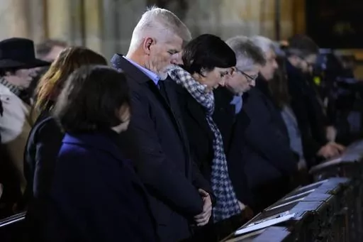 President of the Czech Republic Petr Pavel attends memorial service for the victims of Philosophical Faculty of Charles University shooting in Prague, Czech Republic, Saturday, Dec. 23, 2023. Czech police are investigating why a student went on a dayslong violent rampage culminating in a shooting at the university he attended in Prague that left 14 dead and dozens wounded. (AP Photo/Petr David Josek)