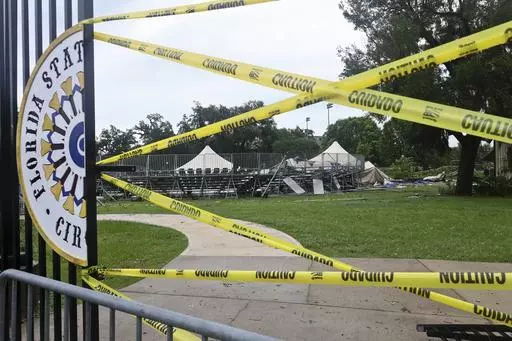 Caution tape blocks the path to Florida State University's Flying Circus bleachers that were damaged when the tent above them collapsed during strong weather in Tallahassee, Friday, May 10, 2024. Powerful storms bringing the threat of tornadoes continued to slam several southern states early Friday, as residents cleared debris from deadly severe weather that produced twisters in Michigan, Tennessee and other states. Some of the strongest storms early Friday rolled into Tallahassee. (AP Photo/Phi