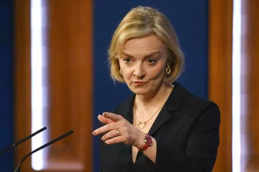 Britain's Prime Minister Liz Truss attends a press conference in the Downing Street Briefing Room in central London, Friday Oct. 14, 2022, following the sacking of the finance minister in response to a budget that sparked markets chaos. (Daniel Leal/Pool Photo via AP)