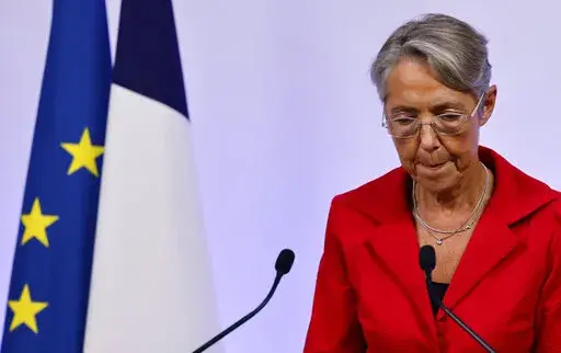 France's Prime Minister Elisabeth Borne reacts as she gives a speech in Paris Sunday June 19, 2022. French President Emmanuel Macron's centrist alliance was projected to lose its majority despite getting the most seats in the final round of the parliamentary election Sunday, while the far-right National Rally appeared to have made big gains. A new coalition — made up of the hard left, the Socialists and the Greens — is projected to become the main opposition force with about 150 to 200 seats