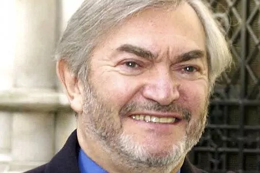 British composer Monty Norman is seen in this March 19, 2001 photo. Norman, who wrote the theme tune for the James Bond films, has died. He was 94. A statement posted Monday on Norman's official website said: "It is with sadness we share the news that Monty Norman died on 11th July 2022 after a short illness." (Kirsty Wigglesworth/PA via AP)