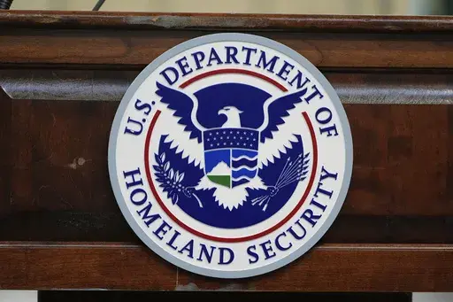 The Department of Homeland Security seal is pictured as Homeland Security Secretary Kristi Noem tours U.S. Coast Guard Air Station Kodiak, Monday, March 17, 2025, in Kodiak, Alaska. (AP Photo/Alex Brandon)