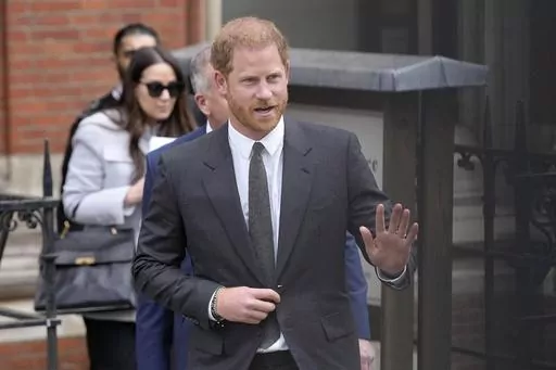 Britain's Prince Harry waves to the media as he leaves the Royal Courts Of Justice in London, Thursday, March 30, 2023. Prince Harry is expected to testify in a London courtroom in June in one of his phone hacking lawsuits against British tabloids. Lawyers for the Duke of Sussex said Wednesday, April 5 in High Court that he will probably testify in early to mid-June. (AP Photo/Kirsty Wigglesworth, file)
