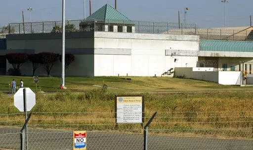 The Federal Correctional Institution is shown in Dublin, Calif., July 20, 2006. The former warden of a federal women’s prison in California will go on trial Monday, Nov. 28, 2022, after prosecutors say he sexually abused several inmates in his case, forced them to pose nude for him and kept photos of the naked prisoners on his government cellphone. Ray Garcia was the warden at the Federal Correctional Institution in Dublin, Calif. (AP Photo/Ben Margot, File)