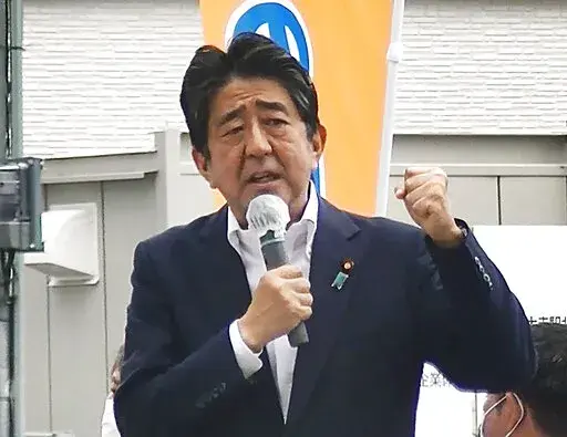 In this image from a video, Japan’s former Prime Minister Shinzo Abe makes a campaign speech in Nara, western Japan shortly before he was shot Friday, July 8, 2022. Former Japanese Prime Minister Shinzo Abe, a divisive arch-conservative and one of his nation's most powerful and influential figures, has died after being shot during a campaign speech Friday in western Japan, hospital officials said.(Kyodo News via AP)