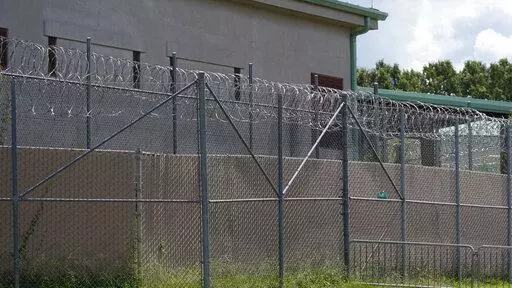 Rolls of razor wire line the top of the security fencing at the Raymond Detention Center in Raymond, Miss., on Aug. 1, 2022. Mississippi’s largest county secured a legal victory Wednesday, Dec. 28, in its effort to stave off a rare federal takeover of its jail, where a judge found “ongoing unconstitutional conditions" for inmates. (AP Photo/Rogelio V. Solis, File)