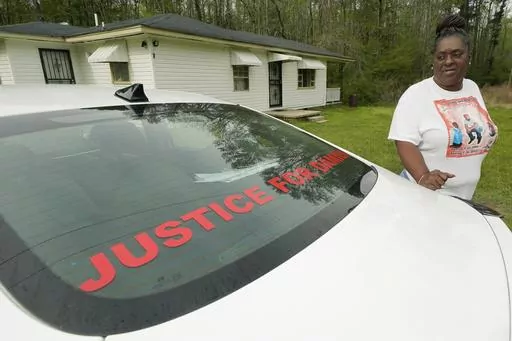 Monica Lee stands outside her eldest son's house in Braxton, Miss., March 21, 2023, as she talks about her youngest son, Damien Cameron. The 29-year-old Black man, with a history of mental illness, died in July 2021 after being arrested by two Rankin County sheriff's deputies. A civil suit can continue against a former Mississippi deputy who pleaded guilty on Aug. 3 to torturing and shooting a Black man in the mouth, with the suit alleging the former deputy is also responsible for the death of a