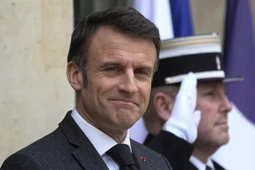 French President Emmanuel Macron waits on the steps of the Elysee Palace, Monday, March 11, 2024 in Paris. On Friday, May 10, 2024, The Associated Press reported on stories circulating online incorrectly claiming that France sent troops to fight in the Russia-Ukraine war. (AP Photo/Michel Euler, File)