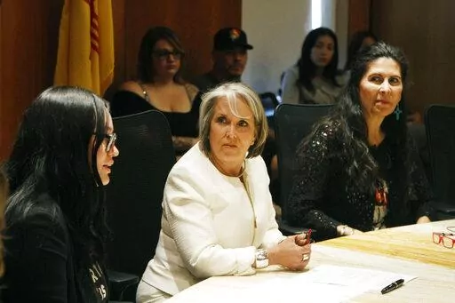 New Mexico Gov. Michelle Lujan Grisham, center, announced an executive order aimed at ensuring safe harbor to people seeking abortions or providing abortions at health care facilities within the state, at a news conference in Santa Fe, N.M., on Monday, June 27, 2022. Lujan Grisham has signed a new executive order that pledges $10 million to build a clinic that would provide abortions and other pregnancy care. She said Wednesday, Aug. 31, 2022, that "the goal here is build it and they will come."