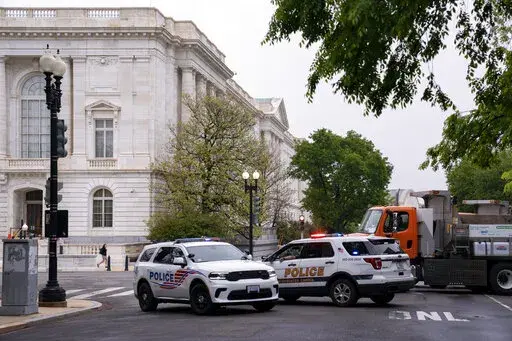 Police vehicles and heavy trucks block access to Supreme Court Building in Washington, Wednesday, May 4, 2022, as security measure are enhanced on the perimeter following protests sparked by news that the court might overturn cases that guarantee abortions. More demonstrations are expected in the wake of a Politico story about Supreme Court Justice Samuel Alito's draft majority opinion, which sets the stage for the court to overturn Roe v. Wade and Planned Parenthood v. Casey. (AP Photo/J. Scott