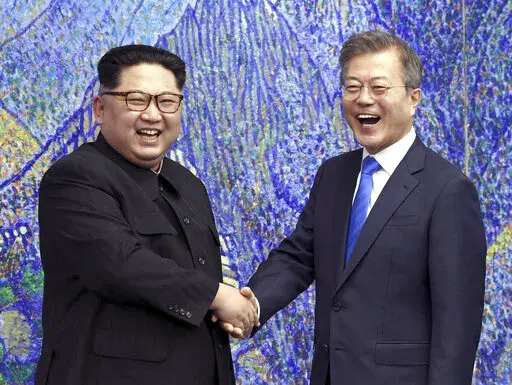 North Korean leader Kim Jong Un, left, poses with South Korean President Moon Jae-in for a photo inside the Peace House at the border village of Panmunjom in Demilitarized Zone, South Korea on April 27, 2018. The leaders of the rival Koreas have exchanged letters expressing hope for improved bilateral relations, which plummeted in the past three years amid a freeze in nuclear negotiations and North Korea's accelerating weapons development. (Korea Summit Press Pool via AP, File)