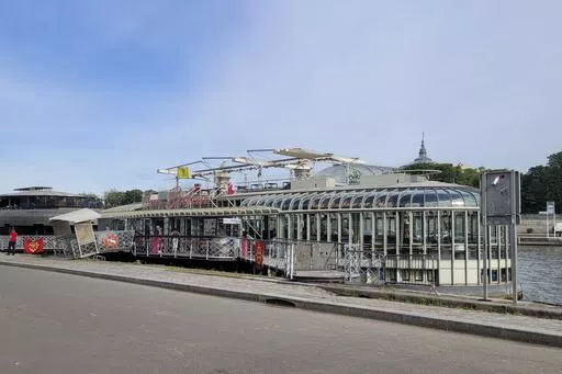 The Pride House is pictured in Paris, Friday, May 17, 2024. The boat, moored between the Grand Palais and the Place de la Concorde in the city center, is meant to be a safe space for LGBTQ athletes and visitors during the Olympics and Paralympics this summer. (AP Photo/Tom Nouvian)