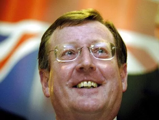 A delighted Ulster Unionist Party leader David Trimble speaks to the media at a hotel in Belfast, Northern Ireland, June 16, 2003, after winning a crucial vote with his party on its continued support for the Irish peace process. David Trimble, a former Northern Ireland first minister who won the Nobel Peace Prize for being a key architect of the Good Friday Agreement that ended decades of conflict, has died, the Ulster Unionist Party said Monday July 25, 2022. He was 77. (AP Photo/Peter Morrison