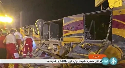 This image taken from a video released by Iranian state television shows the aftermath of a bus crash near Taft, Iran, early Wednesday, Aug. 21, 2024. A bus carrying Shiite pilgrims from Pakistan to Iraq crashed in central Iran, killing multiple people, an official said Wednesday. (Iranian state television via AP)
