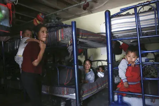 Migrants rest in a dormitory of the Good Samaritan shelter in Juarez, Mexico, on March 29, 2022. The number of migrants attempting to cross the U.S.-Mexico border has surged in recent weeks as the U.S. prepares for even larger numbers with the expected lifting of a pandemic-era order that turned away asylum seekers. (AP Photo/Christian Chavez, File)
