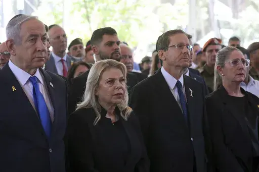 Israel's Prime Minister Benjamin Netanyahu, from left, his wife Sara Netanyahu, President Isaac Herzog and First Lady Michal Herzog, attend a ceremony marking the Hebrew calendar anniversary of the Hamas attack on October 7 2023 that sparked the ongoing war in Gaza, at the Mount Herzl military cemetery in Jerusalem, Israel, Oct. 27, 2024. (Gil Cohen-Magen/Pool Photo via AP, File)