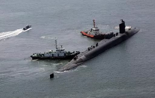 The nuclear-powered submarine USS Michigan approaches a naval base in Busan, South Korea, Friday, June 16, 2023. The United States deployed the nuclear-powered submarine capable of carrying about 150 Tomahawk missiles to South Korea on Friday, a day after North Korea resumed missile tests in protest of the U.S.-South Korean live-fire drills. (Gang Duck-chul/Yonhap via AP)
