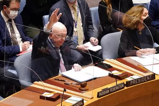 Russia's U.N. Ambassador Russia Vasily Nebenzya casts the lone dissenting vote in the United Nations Security Council, Friday, Feb. 25, 2022. Two days into Russia's attack on Ukraine, a majority of U.N. Security Council members voted to demand that Moscow withdraw. But one thing stood in their way: a veto by Russia itself. Proposals to change the council's structure or rein in the use of vetoes have sputtered for years. But this time, a new approach appears to be gaining some traction. (AP Photo