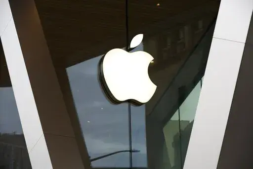 In this Saturday, March 14, 2020 file photo, an Apple logo adorns the facade of the downtown Brooklyn Apple store in New York. Workers at an Apple store in Oklahoma City voted to unionize, marking the second unionized Apple store in the U.S. in a matter of months, according to the federal labor board. The vote on Friday, Oct. 14, 2022,  signaled another win for the labor movement, which has been gaining momentum since the pandemic. (AP Photo/Kathy Willens, File)