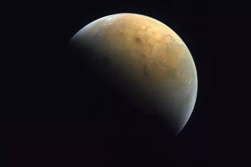 This image captured by the United Arab Emirates' "Amal" ("Hope") probe shows the planet Mars on Feb. 10, 2021. Ancient Mars may have had an environment capable of harboring an underground world teeming with microscopic organisms. That's according to French scientists who published their findings Monday, Oct. 10, 2022. (Mohammed bin Rashid Space Center/UAE Space Agency, via AP, File)