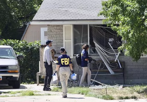 Law enforcement investigate the scene of a shooting involving the FBI on Aug. 9, 2023, in Provo, Utah. The Utah man accused of making violent threats against President Joe Biden before a western states trip last week pointed a handgun at FBI agents attempting to arrest him, the agency said on Monday, Aug. 14, 2023. (Laura Seitz/The Deseret News via AP, File)