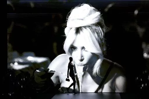 A model wears a creation as part of the Dolce & Gabbana women's Spring Summer 2023 collection presented in Milan, Italy, Saturday, Sept. 24, 2022. (AP Photo/Antonio Calanni)