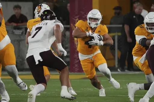 Arizona State running back Cam Skattebo (4) runs the ball against Mississippi State in the first half during an NCAA college football game, Saturday, Sept. 7, 2024, in Tempe, Ariz. (AP Photo/Rick Scuteri)