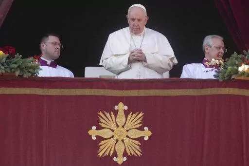 Pope Francis delivers the Urbi et Orbi (Latin for 'to the city and to the world' ) Christmas' day blessing from the main balcony of St. Peter's Basilica at the Vatican, Sunday, Dec. 25, 2022. (AP Photo/Gregorio Borgia)