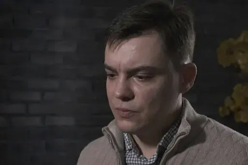 In this image from video provided by the Dossier Center, a London-based investigative group funded by Russian opposition figure Mikhail Khodorkovsky, Gleb Karakulov speaks during an interview in Turkey in December 2022. Karakulov was an officer in President Vladimir Putin’s secretive elite personal security service - one of the few Russians to flee and go public who have rank, as well as knowledge of intimate details of Putin’s life and potentially classified information. (Dossier Center via