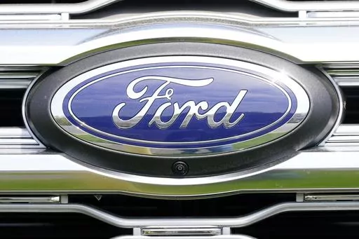 A logo on a vehicle at a Ford dealership in Springfield, Pa., Tuesday, April 26, 2022. Ford is recalling more than 1.5 million vehicles in the U.S. in two actions to fix leaky brake hoses and windshield wiper arms that can break. The company says in documents posted Friday, March 17, 2023 by safety regulators that the front brake hoses can rupture and leak brake fluid. (AP Photo/Matt Rourke, File)
