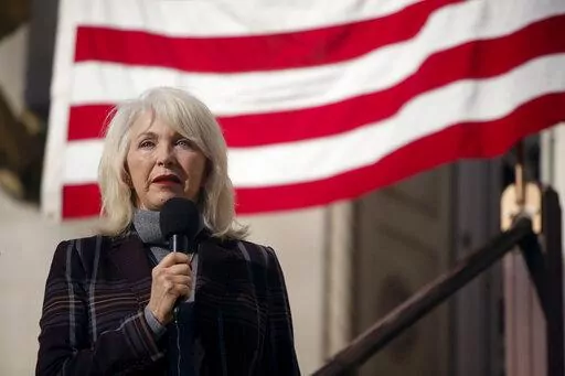 Mesa County, Colo., clerk Tina Peters speaks during a truth and justice rally on Dec. 1, 2021, outside the old Mesa County Courthouse in Grand Junction, Colo.   A grand jury in Colorado has indicted Peters, a county election clerk who has sowed doubt about the 2020 presidential election, alleging she was part of a “deceptive scheme” to breach voting system technology that is used across the country. (McKenzie Lange /The Grand Junction Daily Sentinel via AP)