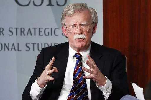 Former National security adviser John Bolton gestures while speaking at the Center for Strategic and International Studies (CSIS) in Washington, Sept. 30, 2019. The Justice Department says an Iranian operative has been charged in a plot to murder former Trump administration national security John Bolton.  (AP Photo/Pablo Martinez Monsivais, File)