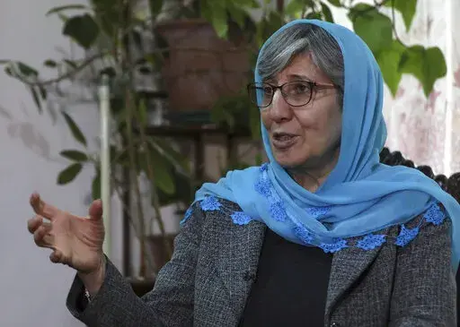 Sima Samar, a prominent activist and physician, who has been fighting for women's rights in Afghanistan for the past 40 years, speaks during an interview at her house in Kabul, Afghanistan, on March 6, 2021, six months before the Taliban takeover of her country. A year after that seismic shift, Samar says that she is still heartbroken over what happened to Afghanistan. (AP Photo/Rahmat Gul)