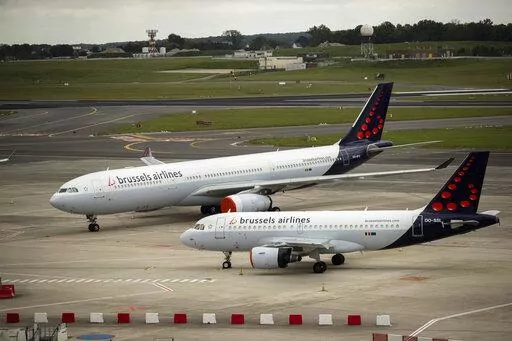 In this Tuesday, May 12, 2020 file photo, planes from Brussels Airlines on the tarmac at Brussels Airport in Brussels Tuesday, May 12, 2020. The European Union's airspace is filling up again with near-empty flights in pandemic times that even airlines admit serve no commercial purpose except securing valuable slots in some of the world's biggest airports. (AP Photo/Francisco Seco, File)
