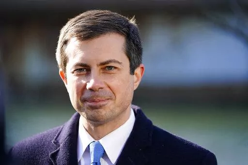 Transportation Secretary Pete Buttigieg listens at an event in Philadelphia, on Jan. 14, 2022. Buttigieg is launching a $1 billion pilot program aimed at helping reconnect cities and neighborhoods racially segregated or divided by road projects. He promises wide-ranging help to dozens of communities despite the program's limited dollars. (AP Photo/Matt Rourke, File)
